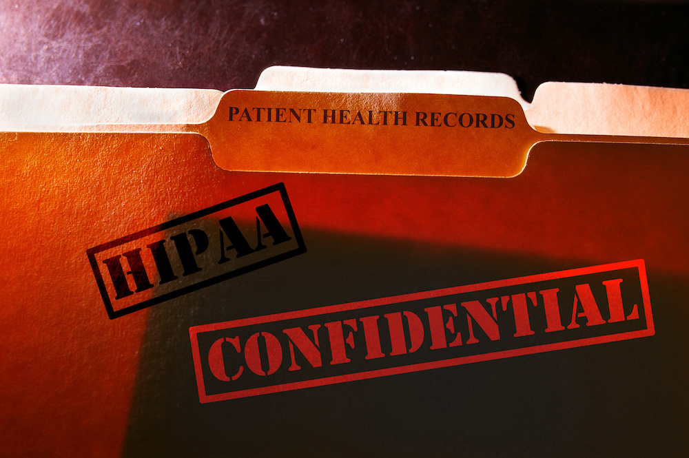 Patient Health Records folder with Confidential and HIPAA stamps