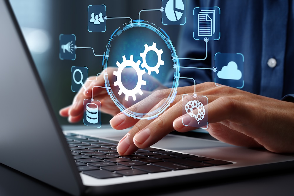 Business process automation BPA and robotic process automation RPA systems. API automation and data transfer with system integration. Businessman using laptop computer with intelligent automation technology.