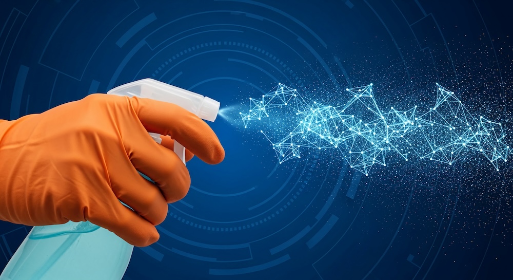Orange-gloved hand sprays disinfectant, forming a digital network pattern, against a blue tech background, symbolizing digital hygiene or clean tech